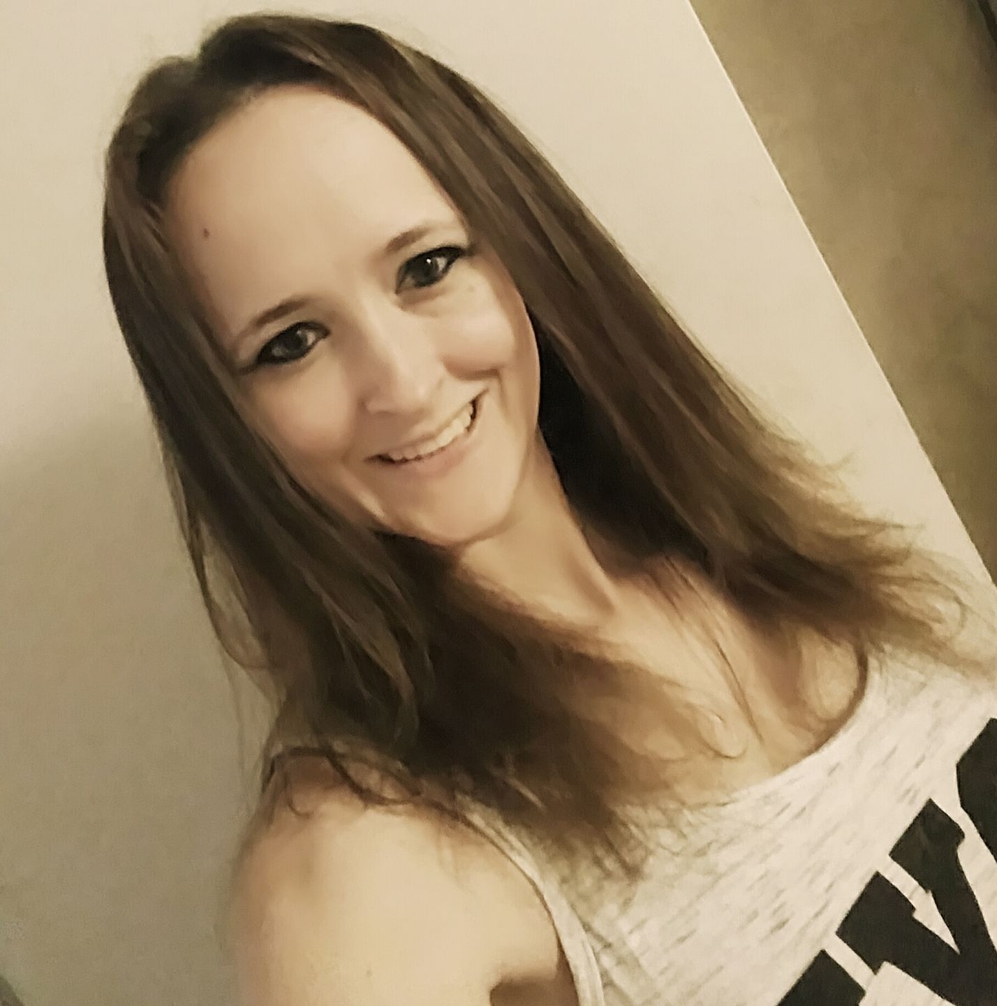 Jolene smiling and relaxing outdoors