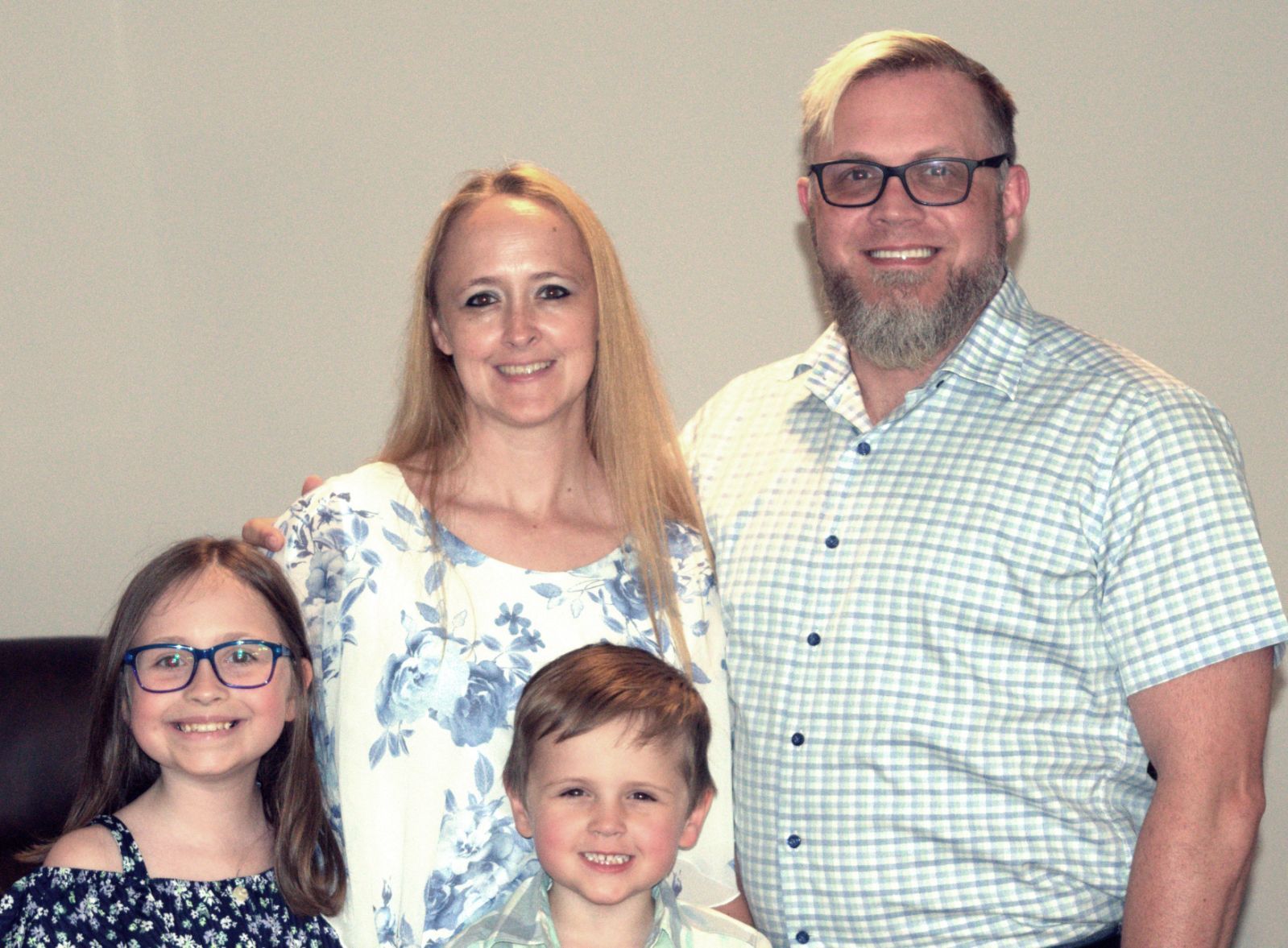 Clayton family smiling together outside the restaurant